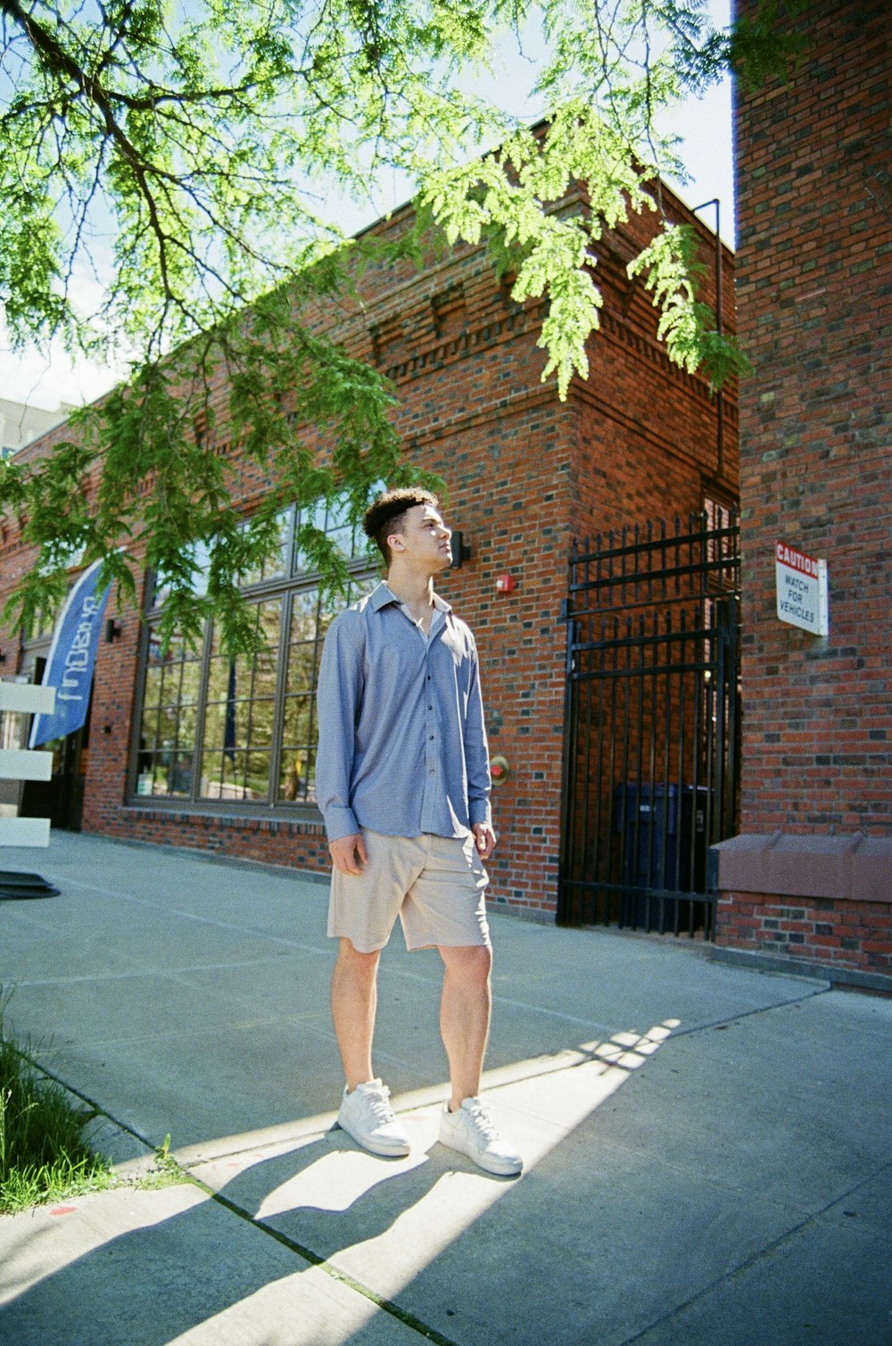 a man standing in front of a gate