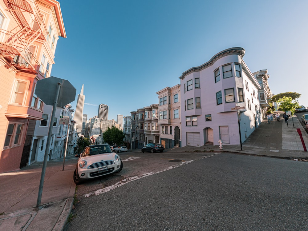 a street with cars and buildings along it