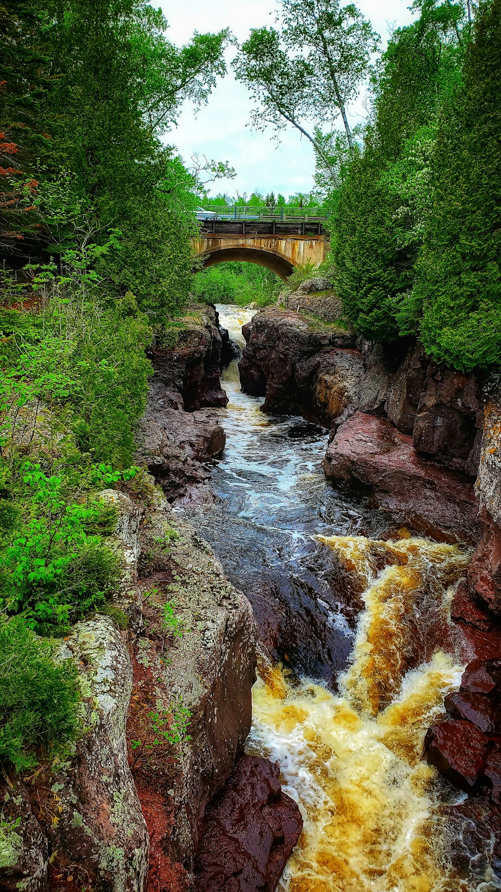 a river with a bridge over it