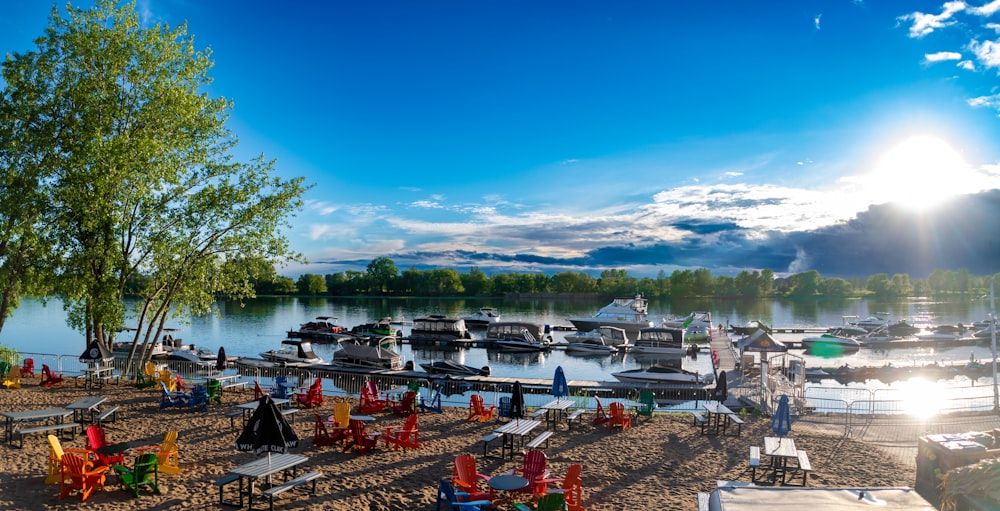 a beach with boats and chairs