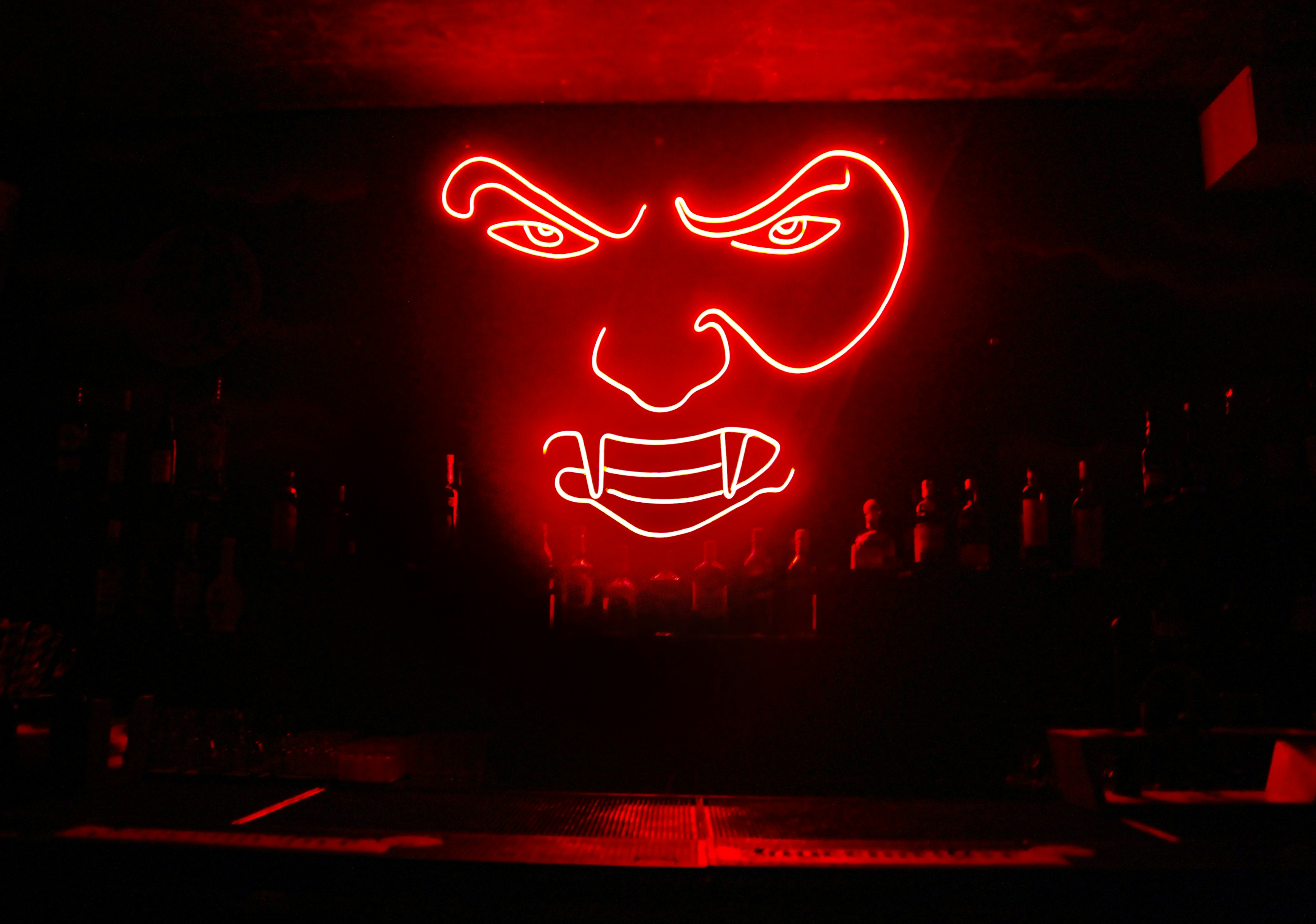 a lit up sign with a face