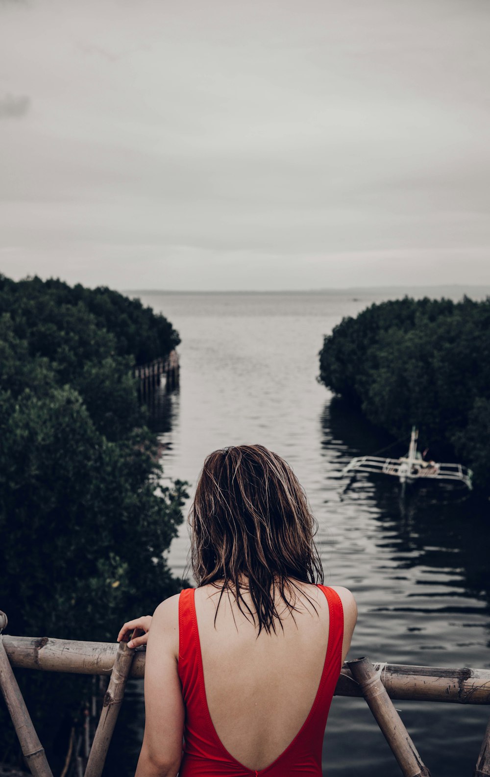 a woman looking out over a body of water