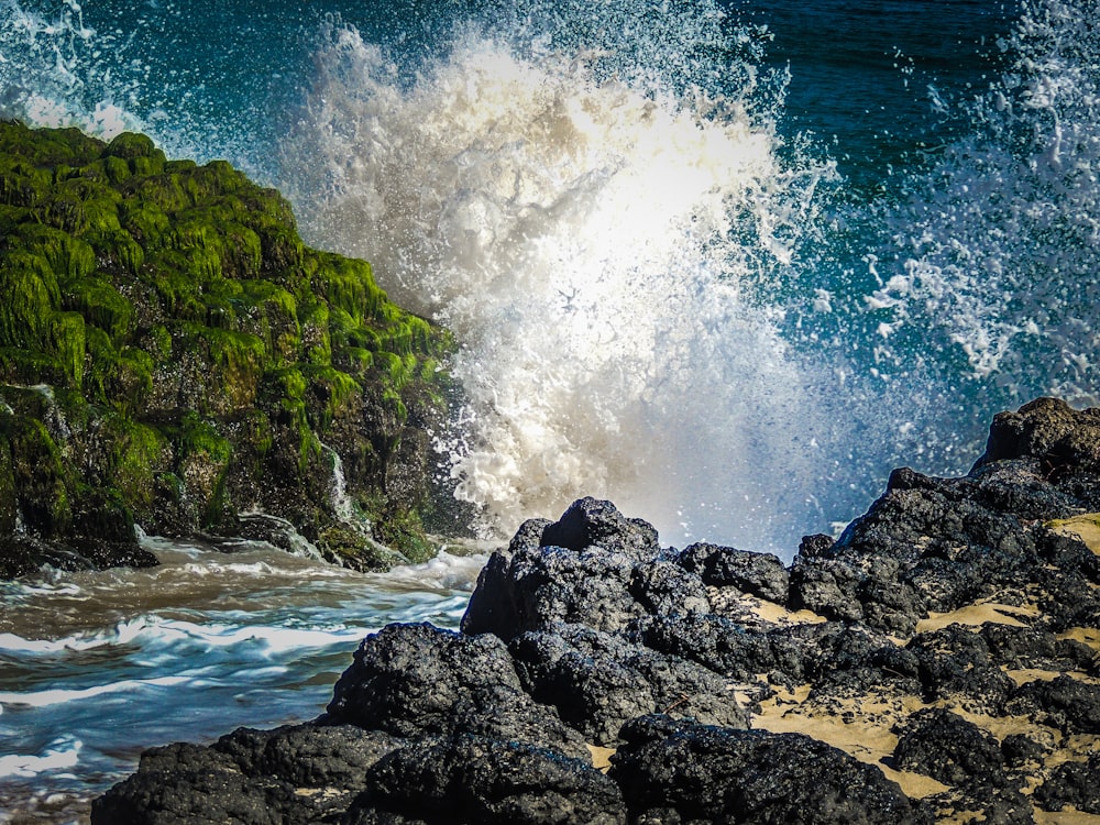 a rocky beach with a waterfall