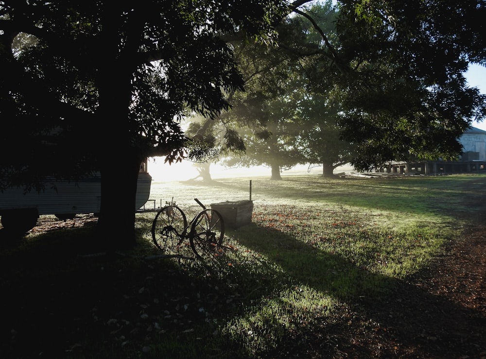 a bicycle parked on a path by a lake