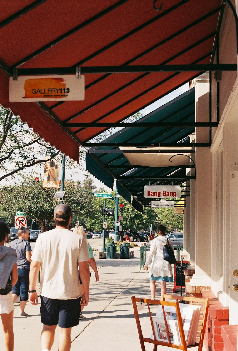 a group of people walking under a covered area