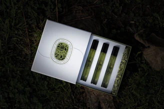 A luxurious trio of attar bottles displayed in an elegant gift box with satin lining.