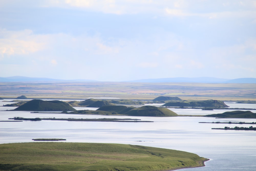 a body of water with land in the back