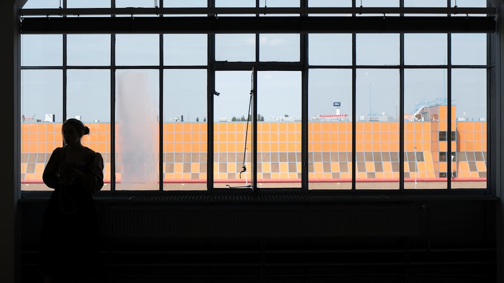 a person standing in front of a window