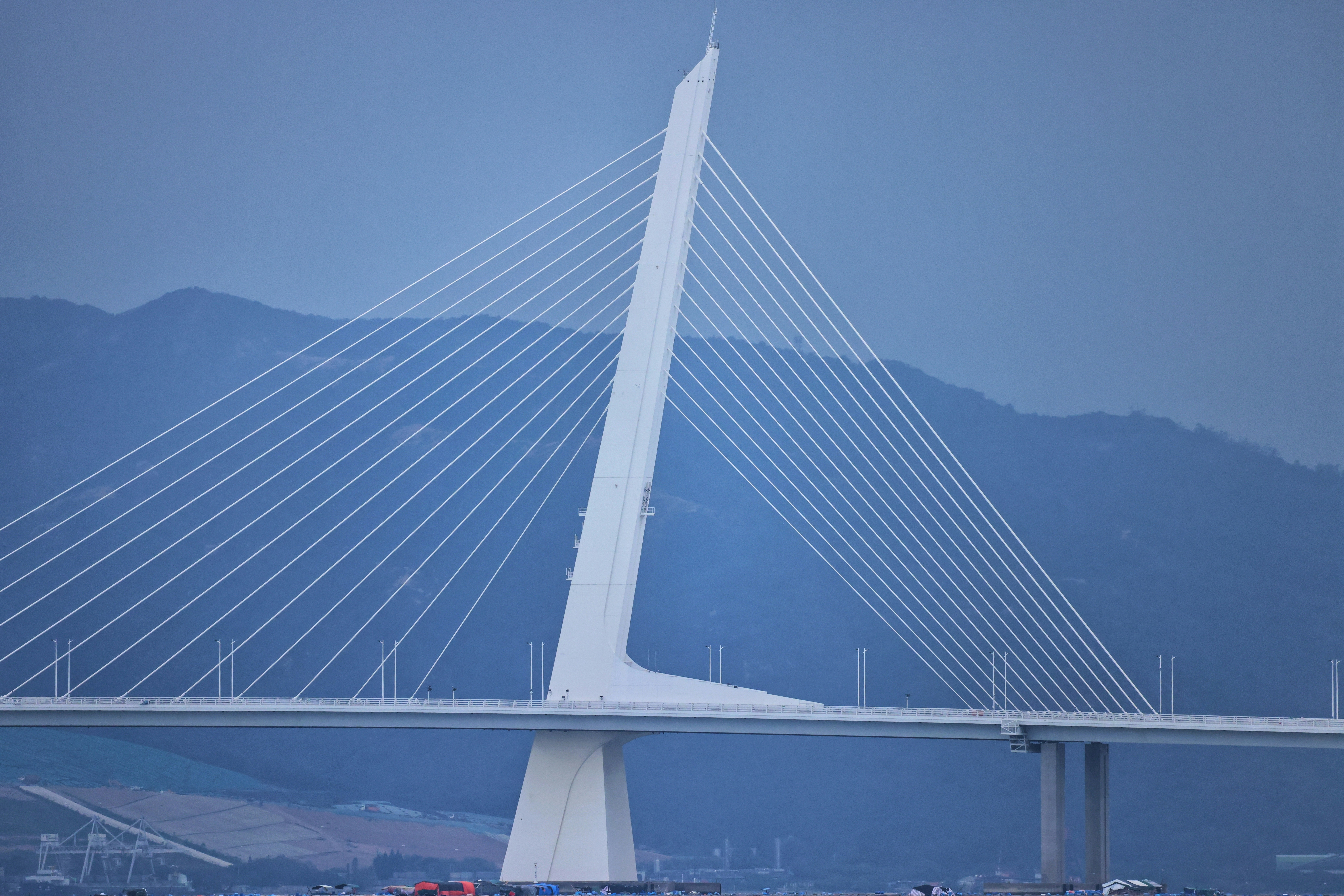 A large bridge with many cables photo – Free Blue Image on Unsplash