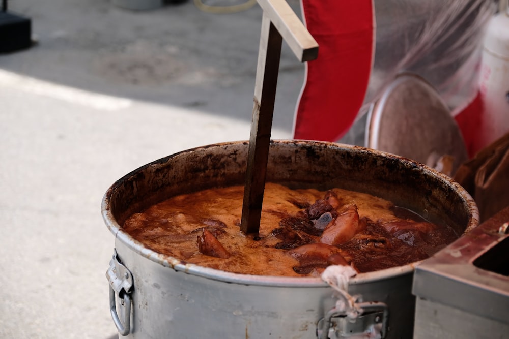 a person cooking food in a pot