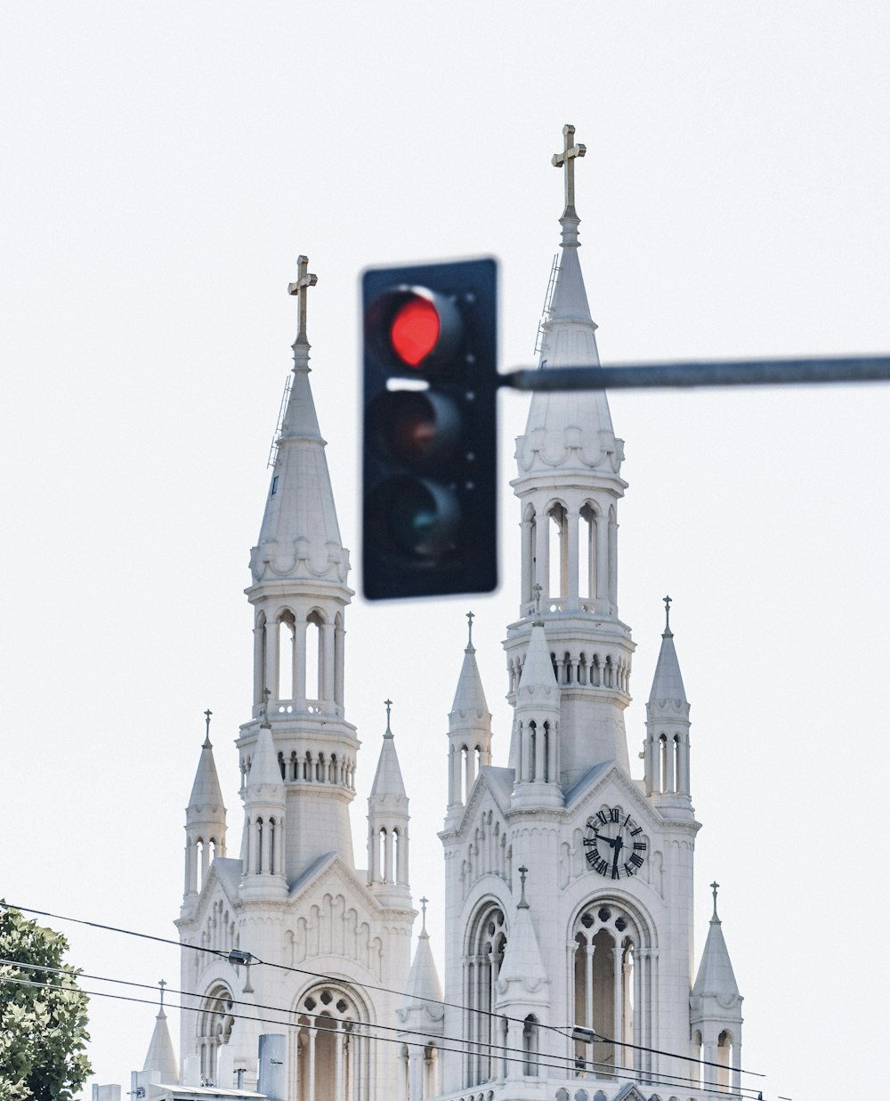 a stop light in front of a church