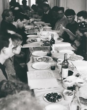 A diverse group of people sharing a meal at a community gathering.