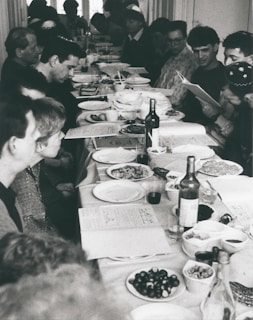 A diverse group of people sharing a meal at a community event.