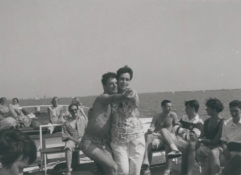Guests participating in a lively dance class on the sunlit deck of a cruise ship.