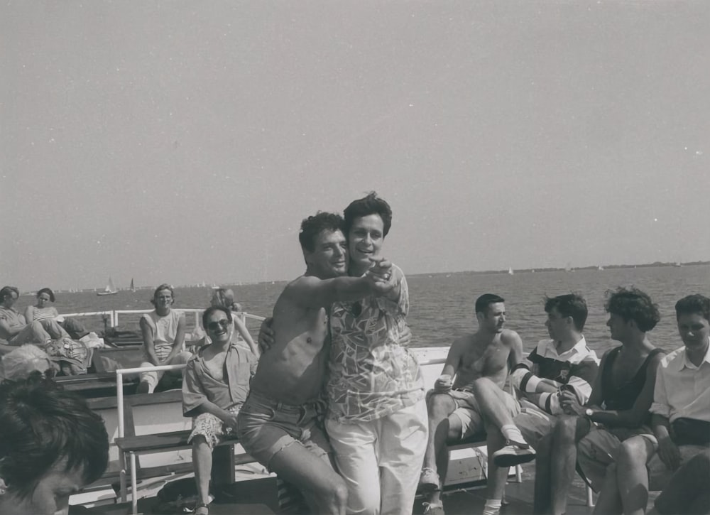 a group of people sitting on a bench