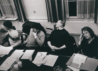 a group of people sitting at desks