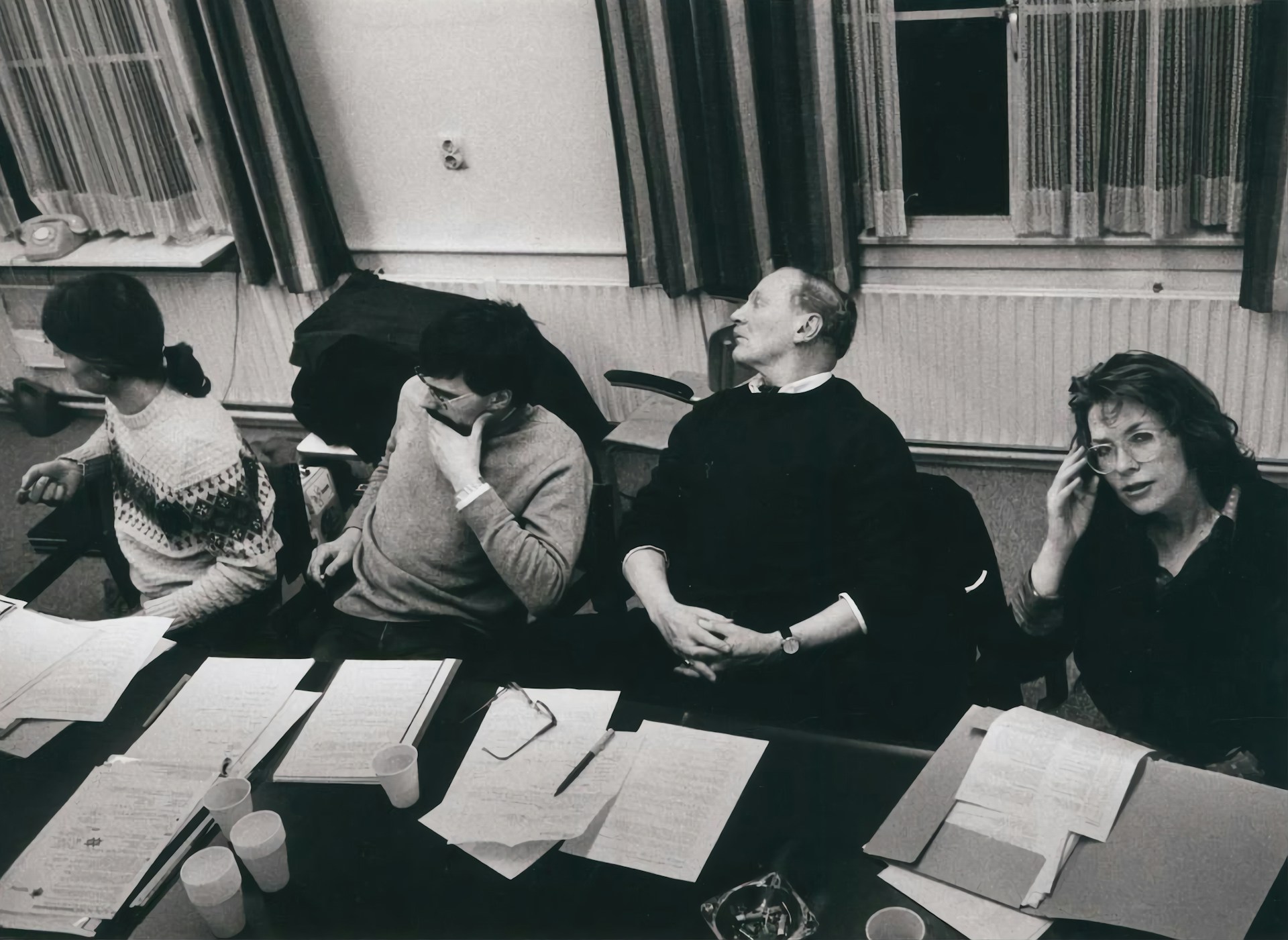 a group of people sitting at desks