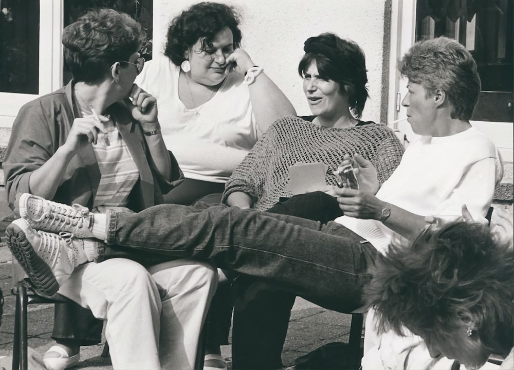 a group of people sitting on a bench