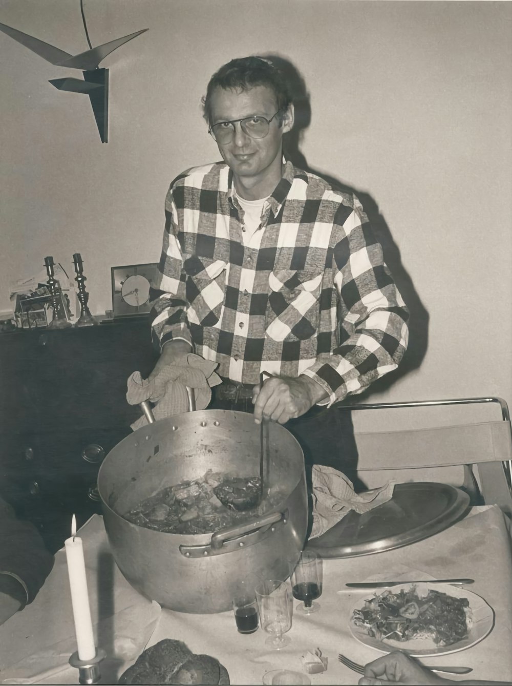 a man cooking food in a pot