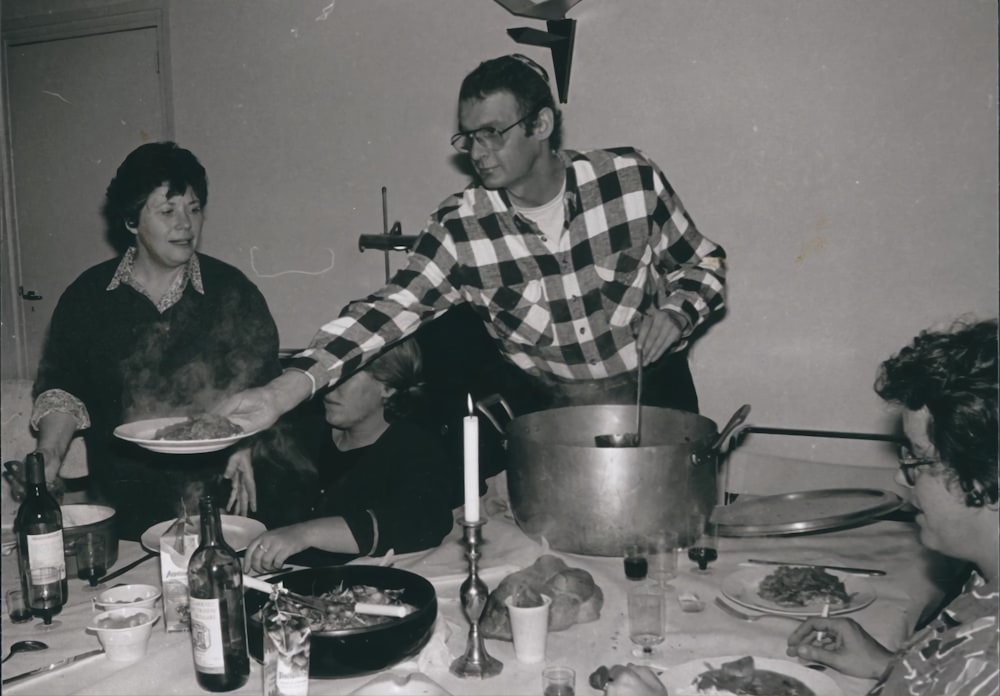 a group of people eating at a table