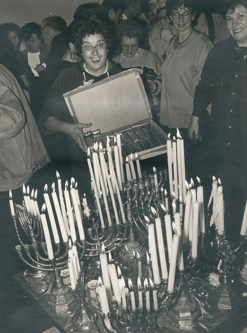 a person holding a box of cigarettes