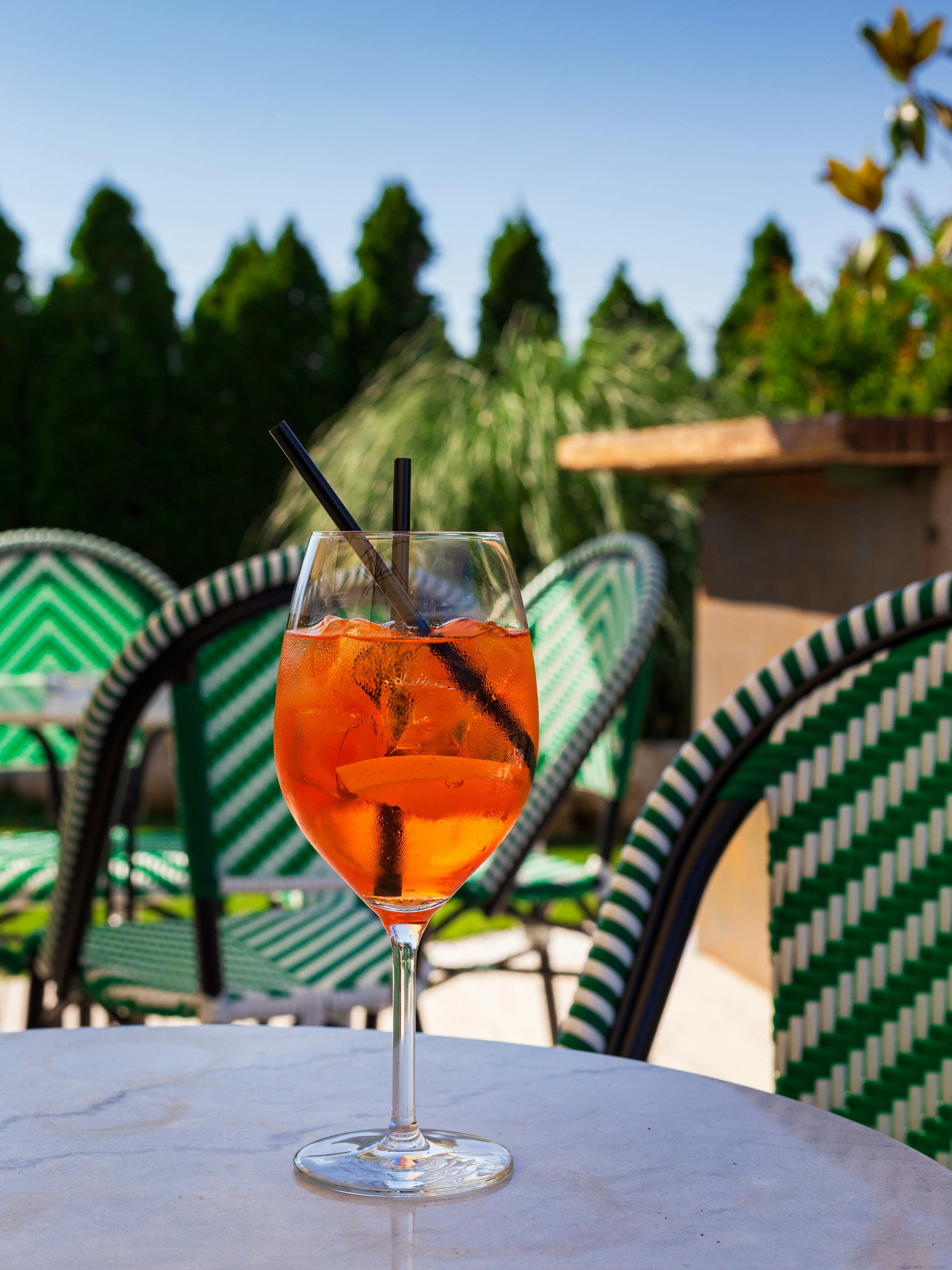 a glass of liquid on a table