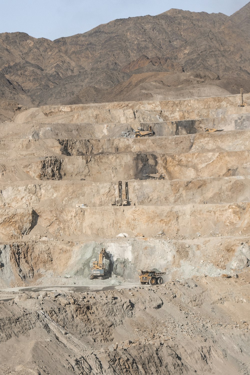 a few vehicles in a quarry