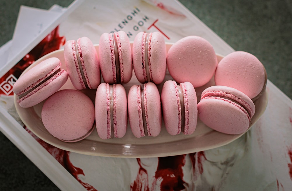 a plate of pink heart shaped cookies