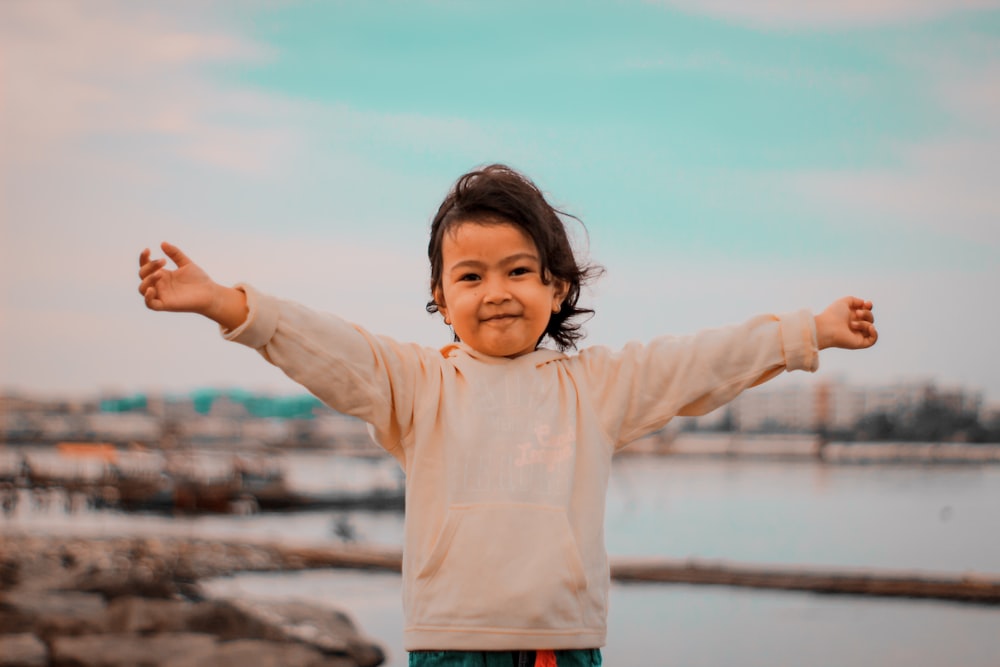 a child standing on a railing