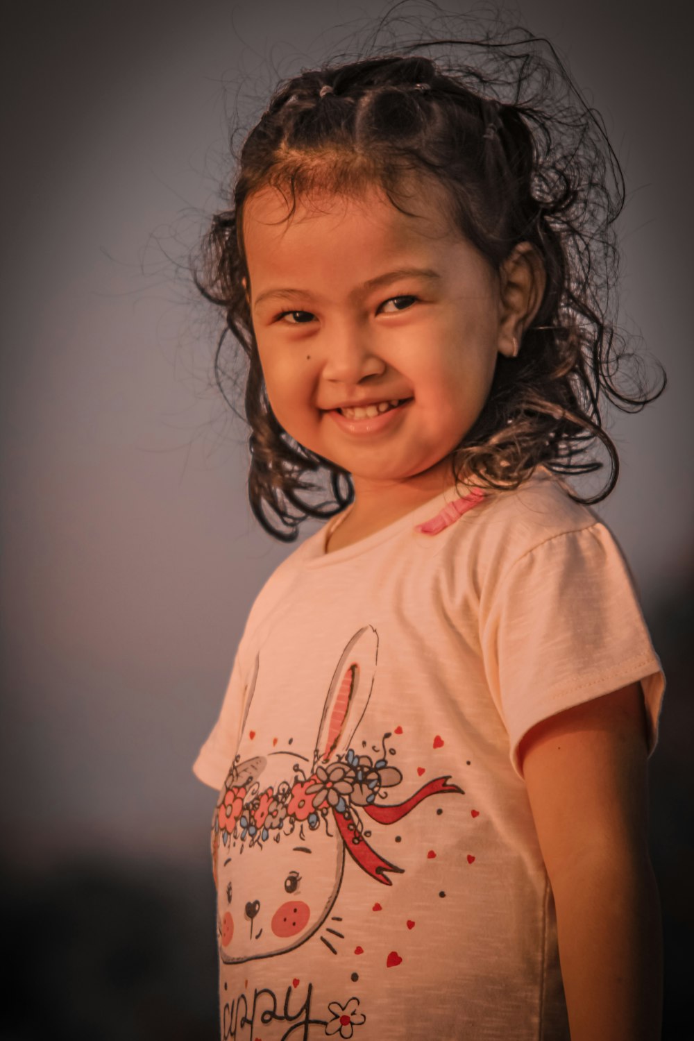 a young girl smiling
