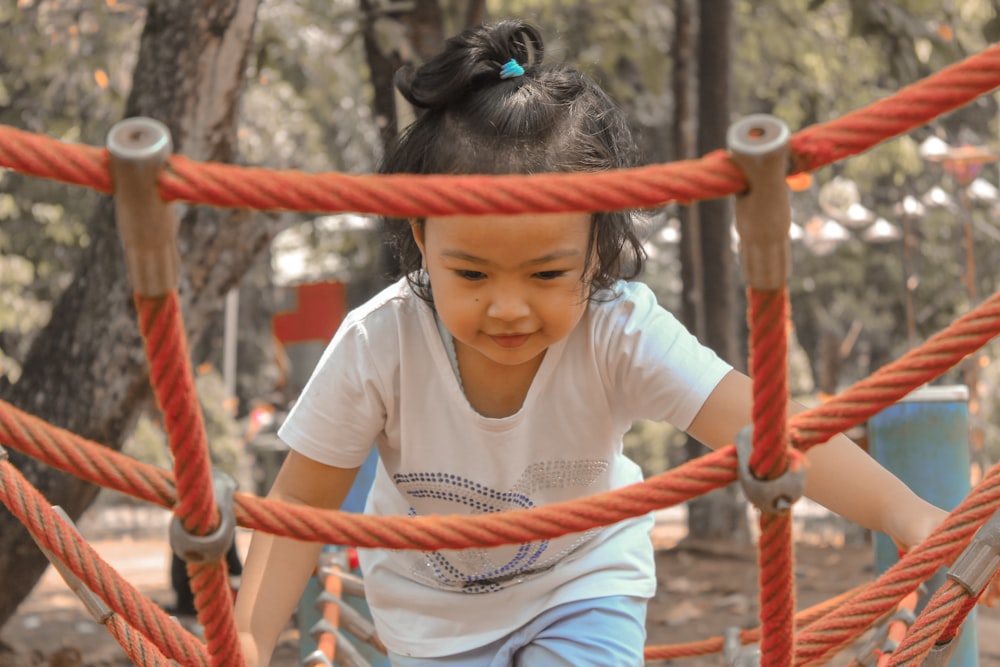 a girl holding a rope