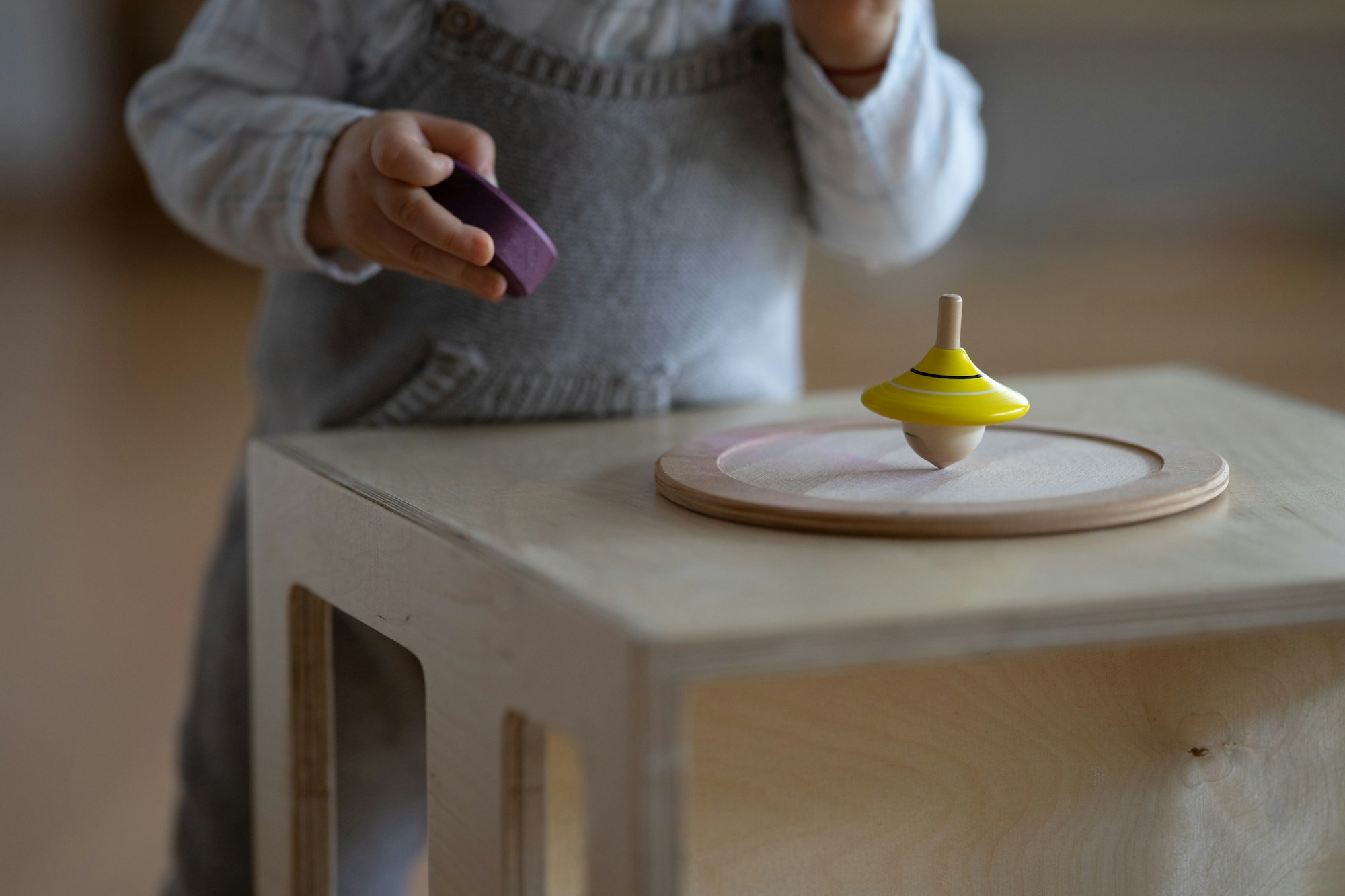 A cute baby discovers and plays in a Montessori nest.