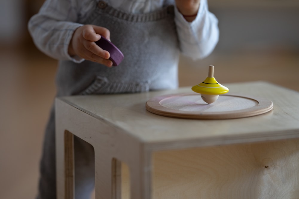 a person holding a purple object