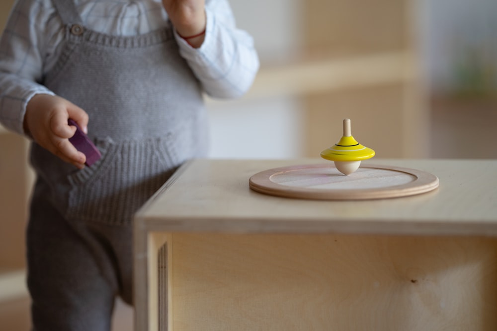 a person standing next to a table