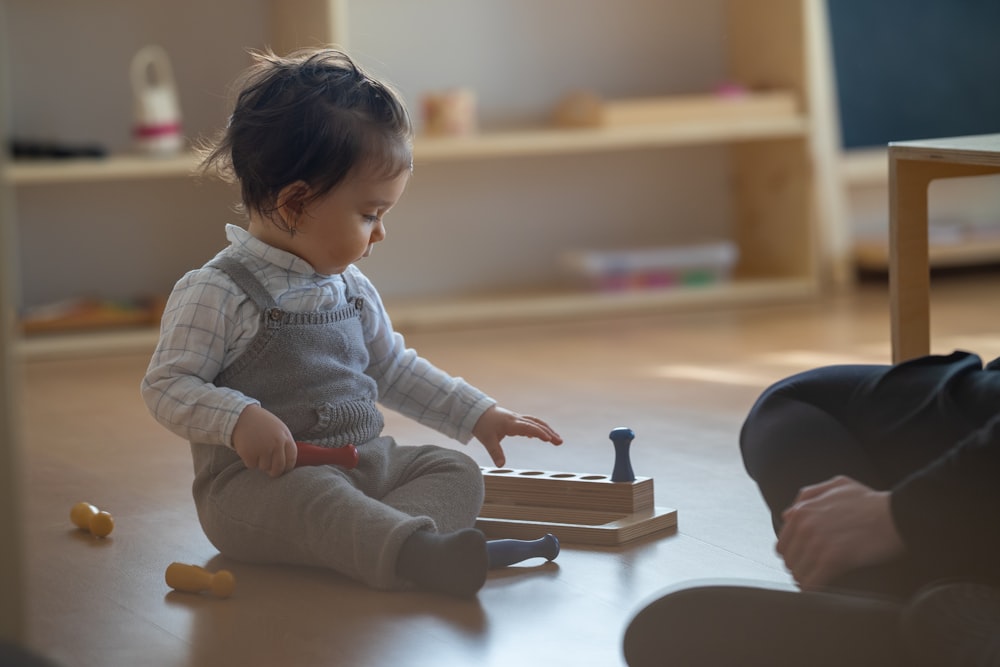 a baby playing with a toy