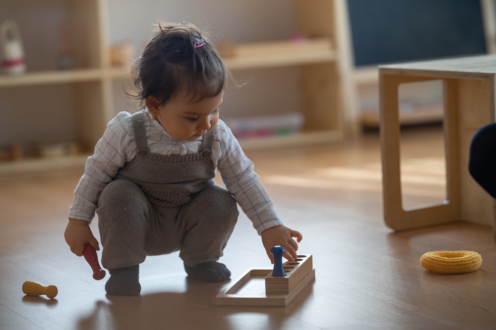 a baby playing with toys