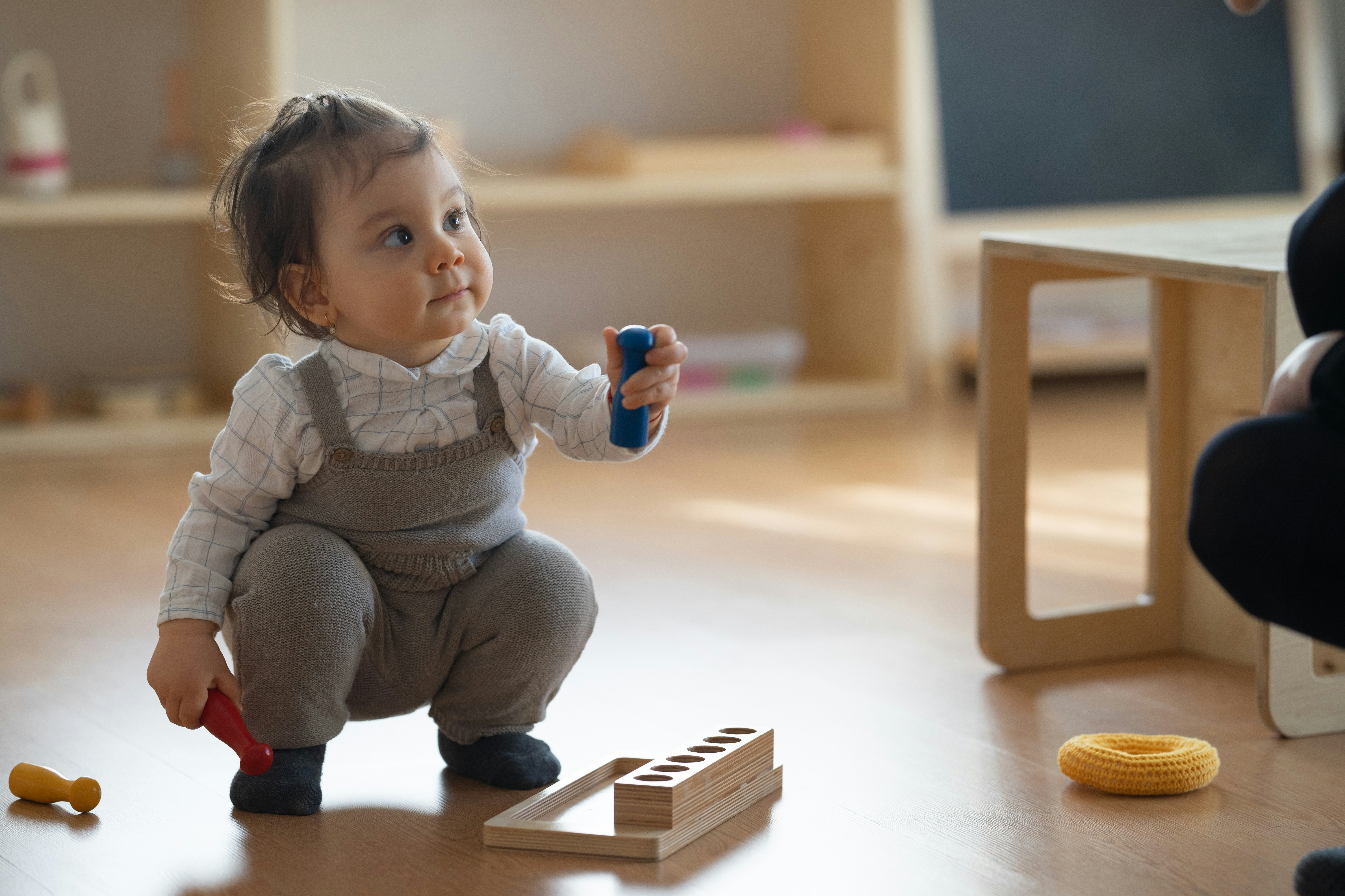 a baby playing with toys