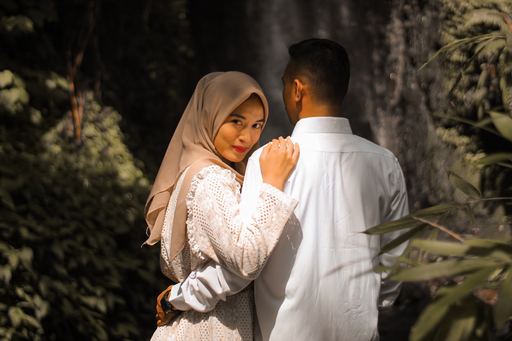 a man and woman in wedding attire