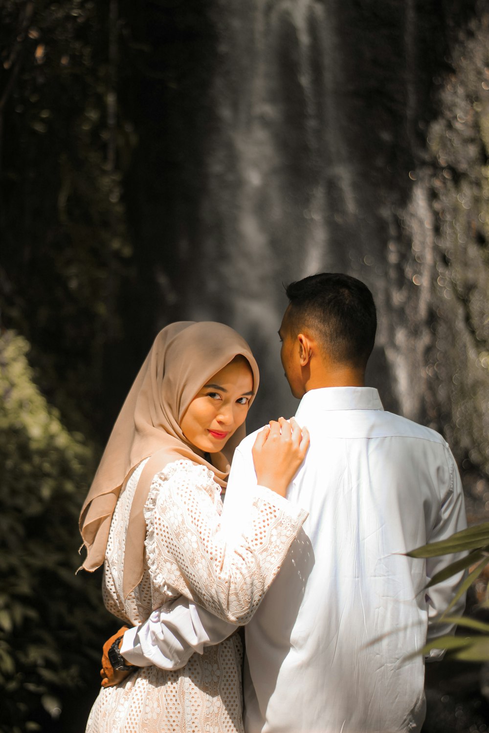 a man and woman in wedding attire