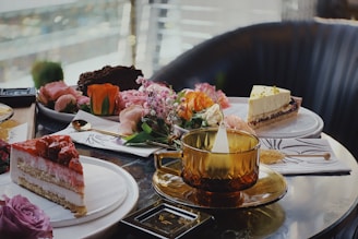 a table with plates of food and drinks on it