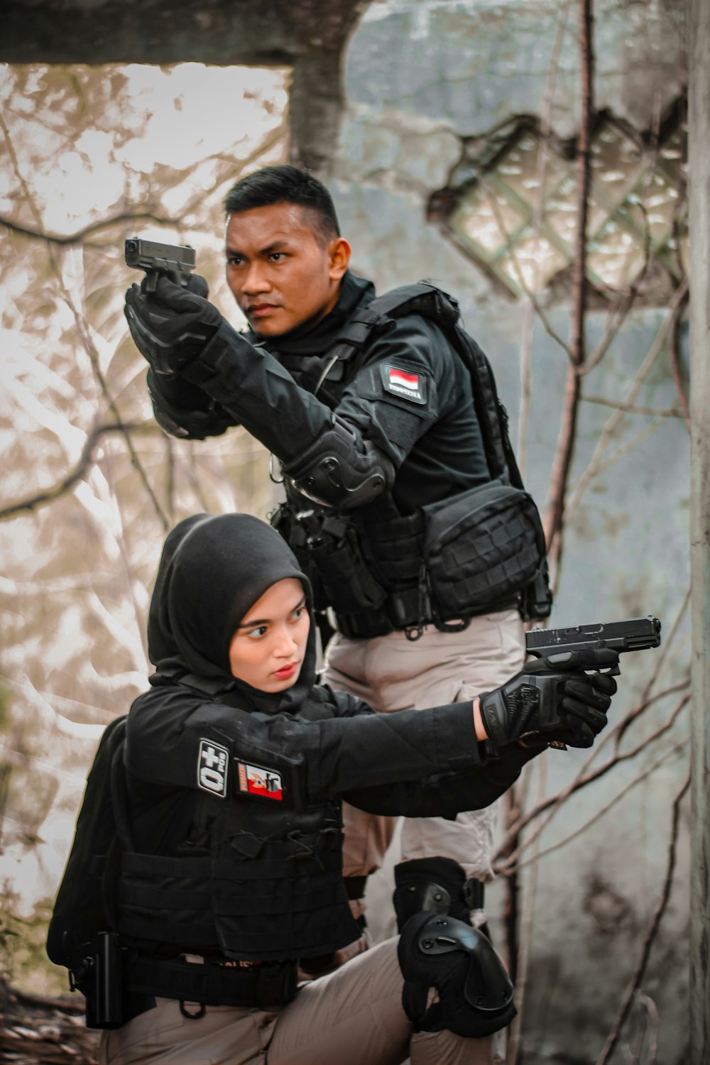 a man and woman in black uniforms