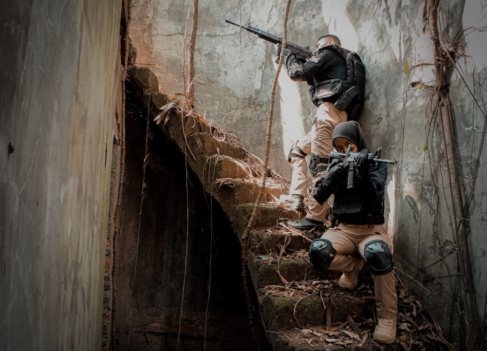 a group of people climbing a wall