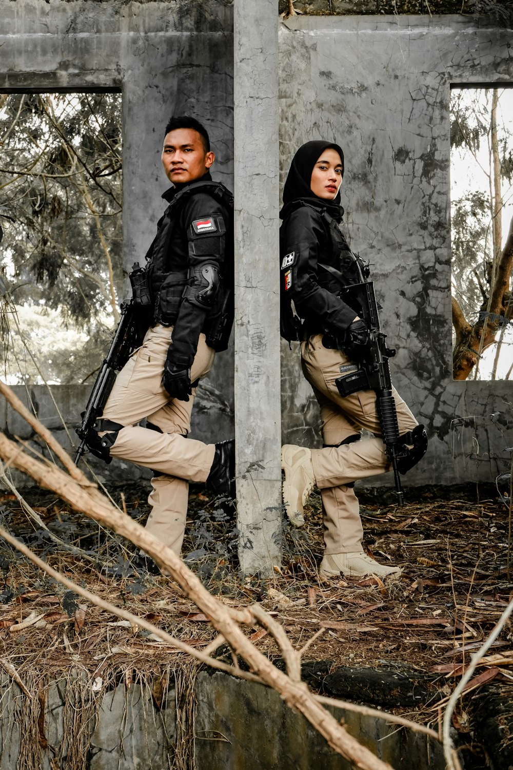 a man and woman in black coats