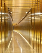 A hallway lined with tall mirrors that visually expand the narrow space in a stylish way.