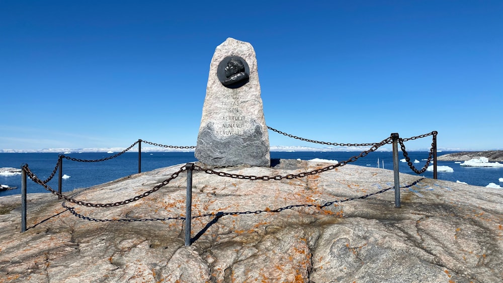 a stone statue on a rock