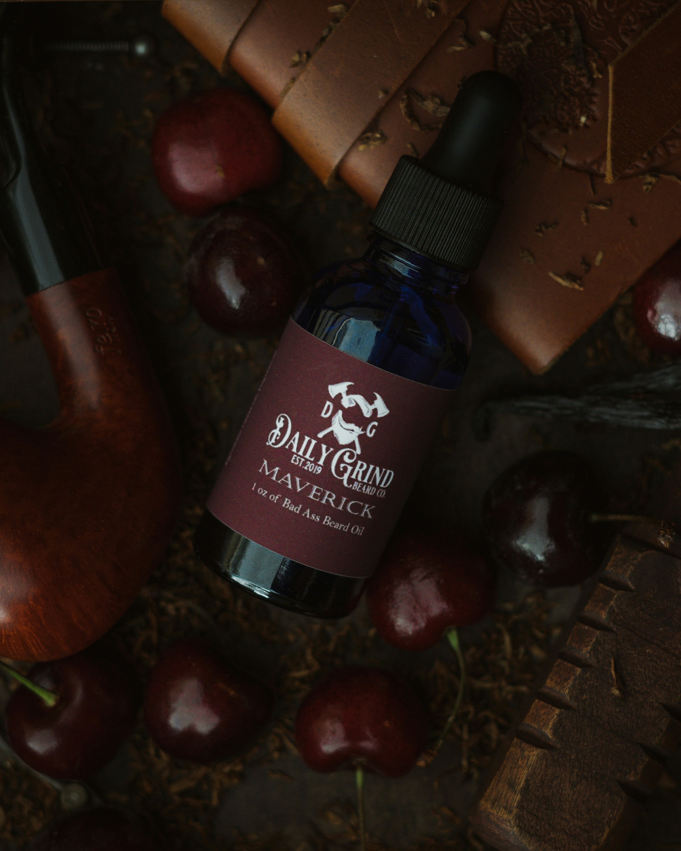 Product photo of Maverick Beard Oil by Daily Grind Beard Co. Product Photography by branding photographer Lance Reis in Portland Oregon. Elements of Tobacco, Wood, Cherry, and Vanilla were added to visually showcase the scents you can expect with Maverick. Did you discover us here? Say hi on insta: Kickassdesigns & daily_grind_beard_co