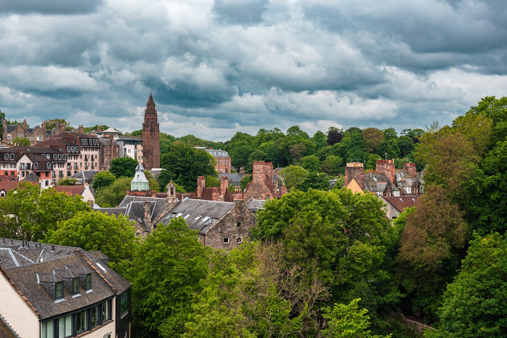 a group of buildings with trees in the front