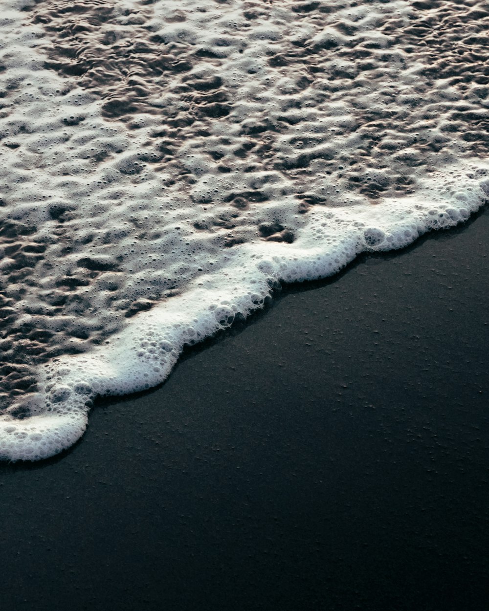 a beach with a body of water