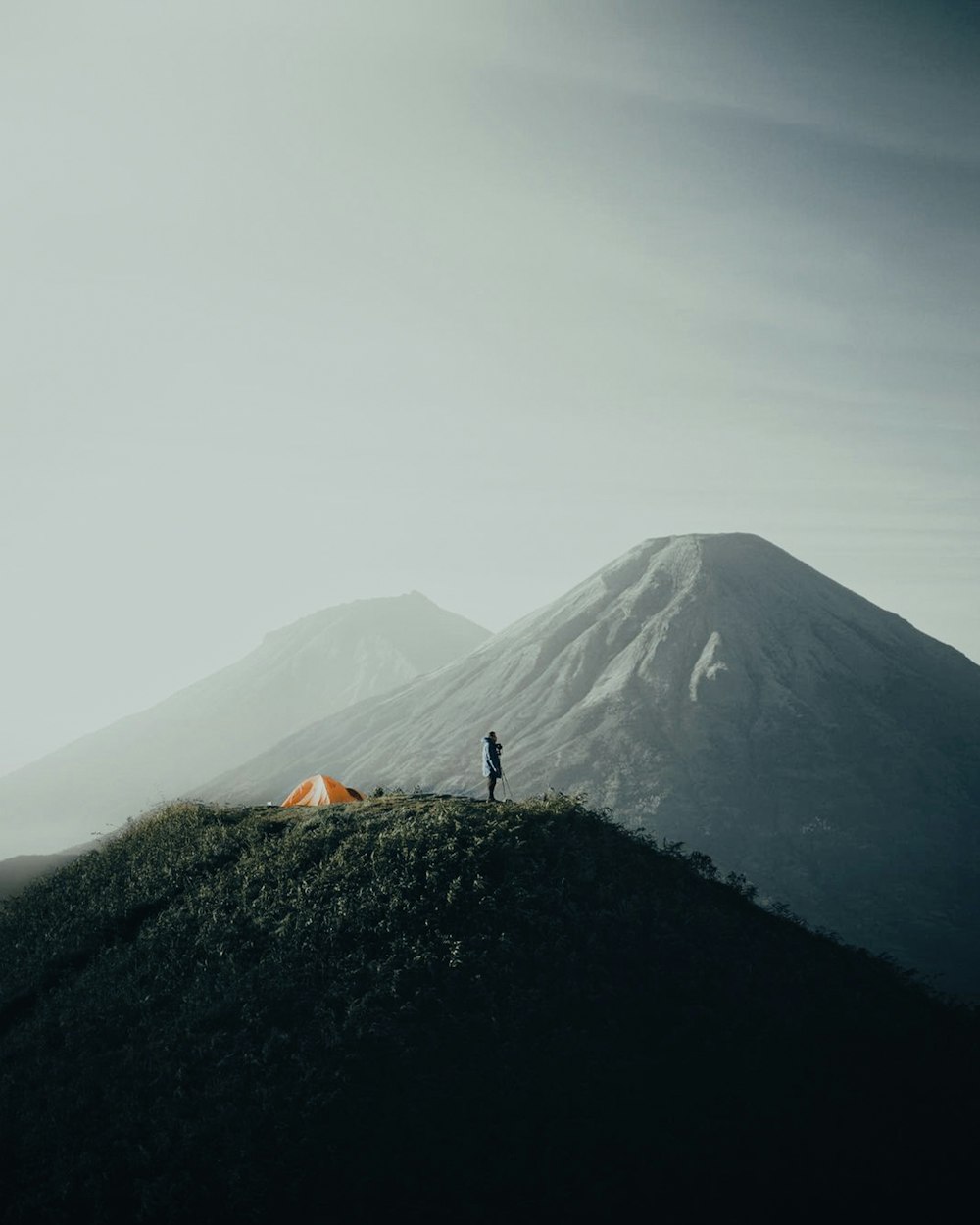 a person standing on a mountain