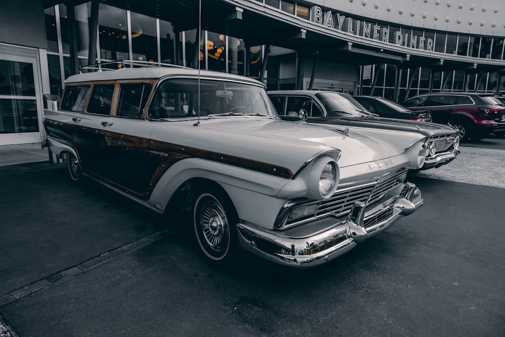 a row of cars parked in a parking lot